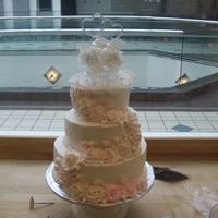 100_0261.jpg Bottom layer was yellow cake with bavarian cream filling. Middle layer was chocolate cake with almond filling. Top layer was chocolate cake...