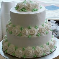 100_0186.jpg Small wedding cake with LOADS of BC roses. The roses took me quite a while to do, but I learned a lot while doing them. I make all of my BC...