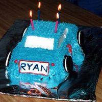 Blue 3-D Car Cake Blue 3-D car cake, with Oreo wheels and a fondant license plate