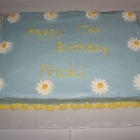 Small Sheet Daisy Cake This is a 9X13 sheet cake frosted with light blue buttercream and decorated with Royal daisies and a shell border.