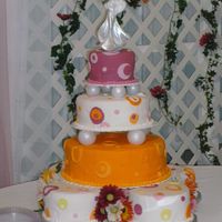 May_003.jpg each cake was a different flavor: white, white w/raspberry filling, orange, lemon w/lemon butter cream, banana w/banana butter cream, and...