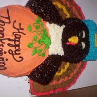 100_6360.jpg Thanksgiving Cake. I promise the chocolate head and wings are borwn and NOT black! haha The picture makes it looks darker.