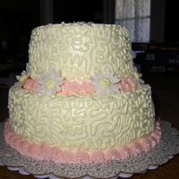 Two Tier 4 firsts for this cake. This was my first time doing Cornelli lace, my first two-tier and gumpaste daisies and using WBH icing.