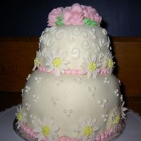 Daisies And Roses A 6" and a 4" cake...my first time using MMF...I didn't do such a good job on it. I think it was too thick and heavy for the...