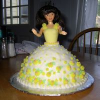 First Doll Cake French vanilla cake with buttercream icing and yellow fondant bodice. My FIL asked me to make a cake for an auction. Maybe I'll drum...