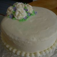 White Roses Vanilla cake with vanilla filling and BC icing roses and royal violets.