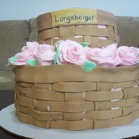 My Friend's Mother's Graduation Cake She sells longaberger. This is my second time working with fondant. Everything is fondant, basket weave, flowers, leaves...there is...