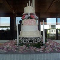 Shannon Monogram I did this cake for a co-worker's wedding. She wanted the monogram which is done in fondant. This is the Wilton candle light stand....