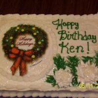 Ken Birthday cake for Ken who has a christmas birthday. This is an edibile image.
