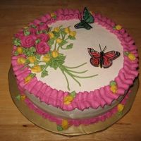 Roses And Butterflies white 10" round torted and filled with strawberry preserves, all buttercream except the butterflies; found those at the craft store