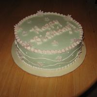 Ccnew_2346.jpg 10" round, chocolate pound cake with a chocolate fudge filling, iced in buttercream with fondant flowers. I saw this design on a...