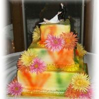 Tie-Dye This was one of my funnest cakes yet. It is tie-dye air brushed buttercream with real gerbera daisies.