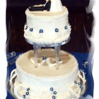 Based On Original Wilton Course 3 Cake The bride saw my course 3 cake on my site and wanted it duplicated only with navy flowers. I like this version better.