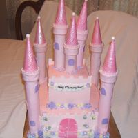My First Castle Cake - I Don't Think This Uploaded The First Time This took Way too long for the price! Buttercream with fondant walls,turrets, and flowers. Thank you CC for all the castles that inspired...