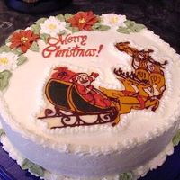 Christmas2004.jpg This is 3 layer chocolate cake with chocolate and whip.cream feeling, stab. whipping cream icing. Royal poinsettias, picture is a chocolate...