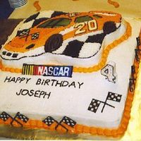 Tony Stewart #20 Cake This was done with the Wilton race car pan the numbers and race flags are colorflow as well as the nascar logo