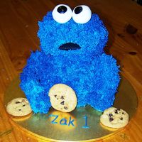 Cookie Monster My very first 3d cookie cake. I was pretty happy. I used rice crispies for the arms and legs and skewered them in. One arm half fell off so...