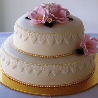 Lace Fruit cakes iced in fondant. I bought a lace cutter from spotlight , putting it on the cake straight was a bit hard, it kept wanting to...