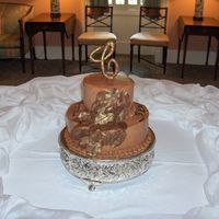 Golden Leaves Groom's Cake A small groom's cake decorated with gold dusted chocolate leaves and a big C, the groom's initial.
