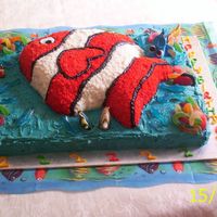 100_1312.jpg Made this for my grandson as he is Nemo crazy... all the little ones wanted to take the"sharks" out of theocean. Shaped Dorey out...