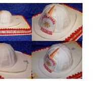 My First Firehelmet Cake helmet was made from 5 8" stacked cakes and covered with Satin ice fondant. shield and brim made with gumpaste. logo on shield was an...
