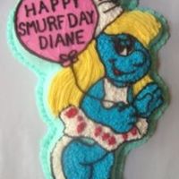 Happy Smurfday Shaped character pan decorated with buttercream stars.