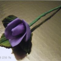 Purple Rose Gumpaste rose, shadowed and highlighted with powdered colors