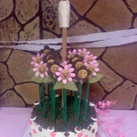 Tub Of Flowers Covered in Swiss Meringue Buttercream Frosting, this two-tier octagon cake was carved from two 14-inch by 3-inch round cakes. It is simply...