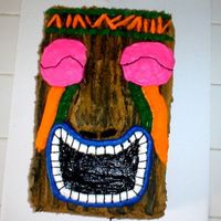 Tiki Cake This is a tiki cake I did for my nephews 15th birthday. Chocolate cake with all buttercream.