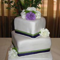 Purple And Green Wedding Carnations and ribbon provided by the bride.