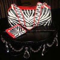 Zebra Purse I made this cake for my daughter's 7th birthday. The cake is pumpkin spice with vanilla butter cream covered in fondant. I painted on...