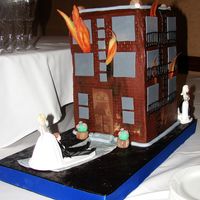 Burning Building I love to do fun groom's cakes. This groom is a fireman. We decided on a burning building with the bride pulling the groom away. I...