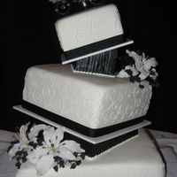 Black And White Wedding Five teir wedding cake, french vanilla cake with chocolate buttercream the 2 black teirs are stroyfoam, my first time making gumpaste...