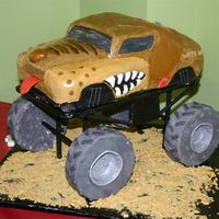 Monster Mutt My husband helped me with this one he built the stand and I carved the cake used buttercream frosting with fondant this was for my sons 4th...