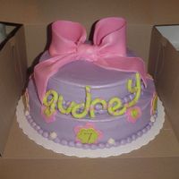 Big Bow 8" on top of 10". All BC with fondant accents and bow. Sprayed with luster dust.