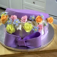 Hat Box Full Of Flowers Vanilla Bean Pound Cake with Strawberry Cream Fosting, covered in MMF and decorated with gumpaste flowers. Think I am finally getting the...