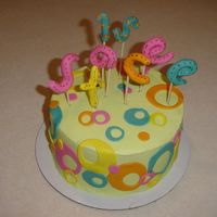 Neon Circles I love Americolor Electric colors! covered in BC. Everything else is fondant. The name is Stacee and behind it is the # 15, not too clear...