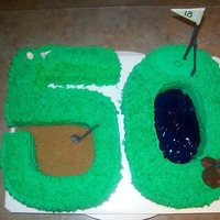 50Th Golf Cake This is a half french vanilla and half is chocolate. It has butter cream icing with fondant figures on it.