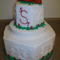 Rose Wedding Cake Bottom layer is a two tier hexagon cake. The middle cake is half of a single layer, it was added so the cake would appear taller. The top...