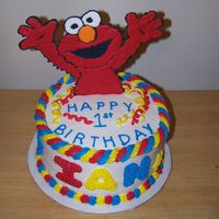Elmo Cake This was for a little boy's first Birthday. Elmo is made out of royal icing and the streamers are MMF.