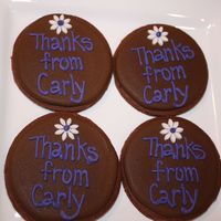 Thank You Cookies 3.5" chocolate cookie rounds covered with royal icing. These were made for a little girls party.. they were putting them in the loot...
