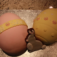 Easter Eggs 2 Easter Egg Cakes (covered in fondant) with a chocolate cookie decorated in Royal Icing.