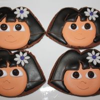 Dora Cookies Dora the explorer cookies.Chocolate cookies cut out by hand and decorated with royal icing.
