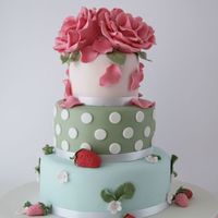 Cath Kidston Cake Design of cake is inspired by Cath Kidston. Roses and strawberries is made out of modelling paste. TFL