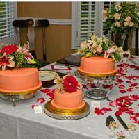 Splenda Round Peach Colored Italian Cream Wedding Cakes 3 italian cream cakes using splenda, covered in sugar free icing, and peach colored fondant. All flowers are real.