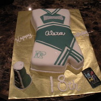 Cheerleader Uniform full sheet cake.shirt was choc and skirt white. sketched out design on paper and used to cut individual items. covered in white fondant...