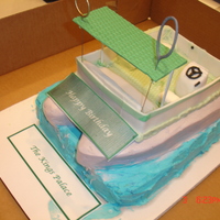 3D Pontoon Boat Fondant, buttercream, edible images, and melting chocolates.