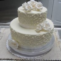 Small Scroll Cake 10 6 round. Buttercream with scrolls. Silver gumpaste roses