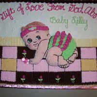 A Gift From God A 12 by 18 cake frosted with buttercream. The baby appears to be embossed but is actually cut from a baby shaped cake pan. The only...