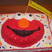 Elmo I used the Wilton's Elmo pan and placed it on a sheet cake.It was my first cake like this.